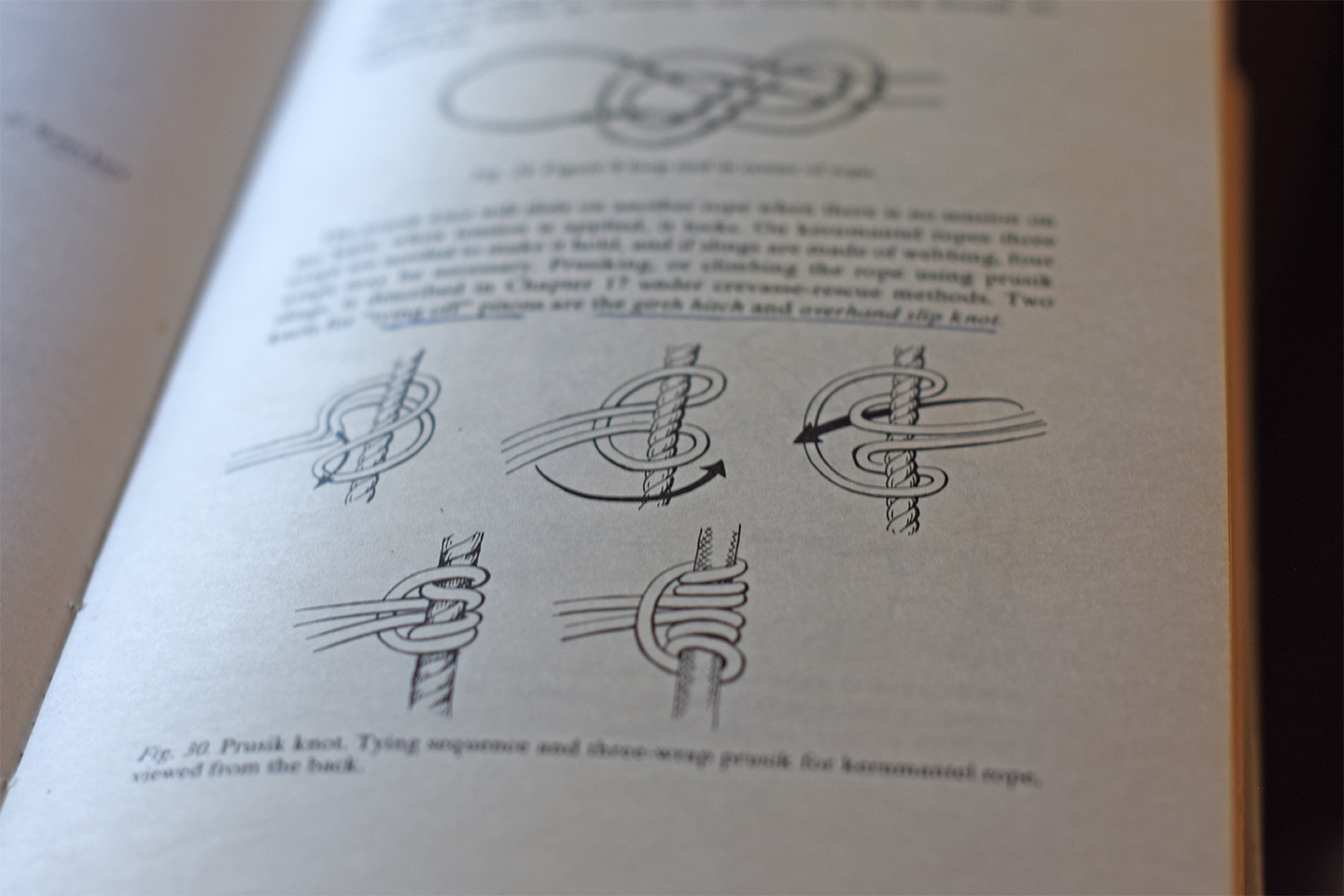 Page of book showing how to tie a prusik knot, which is a girth hitch repeated three times
