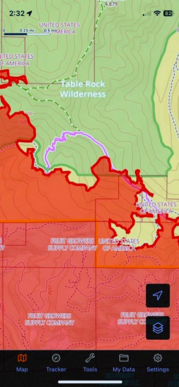 A screenshot of a mapping app with Table Rock Wilderness labeled with a green outline of the area, and a large red area indicating burned areas