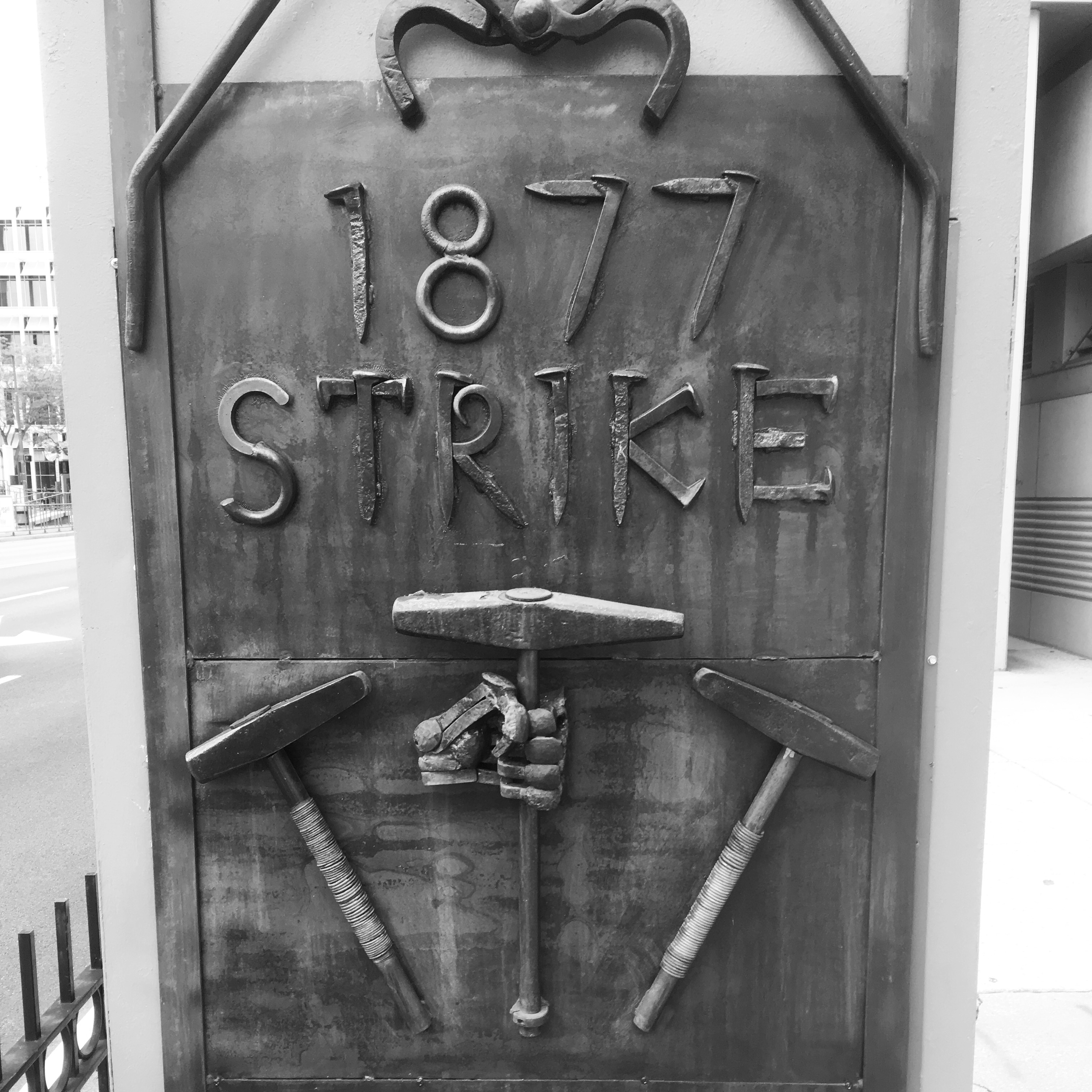 Artwork celebrating the 1877 rail strike on a bus stop near the convention center