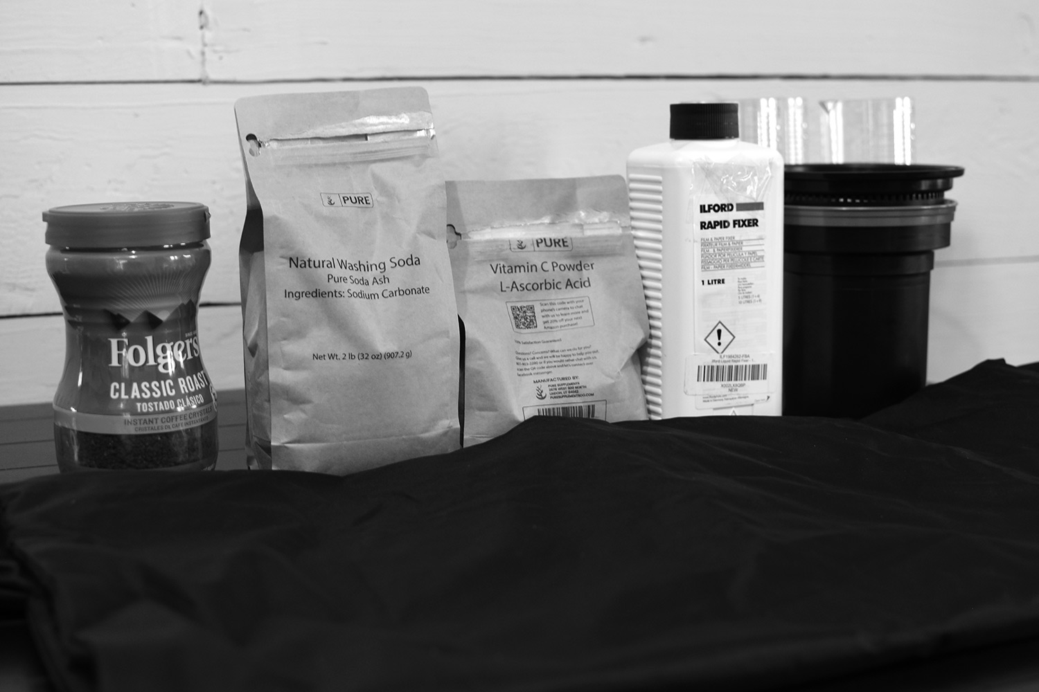 Photo development tank, folgers instant coffee, washing soda, vitamin c, changing bag, beakers, and paterson development tank