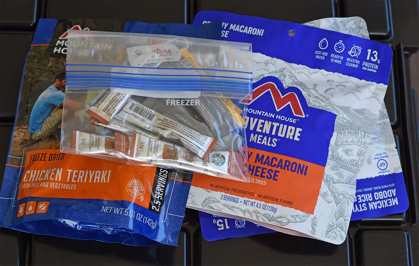 Packages of mountain house dehydrated food, instant coffee, and packets of electrolytes